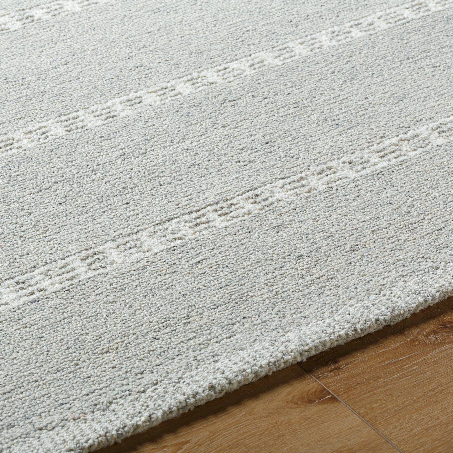 005 SI-2131619,SI-2131620,SI-2131621,SI-2131622 | Closeup | Brook Rug - 485567 by Livabliss in silver, dove gray, ivory. Made from face: 100% wool, warp: 100% cotton in a unique style.