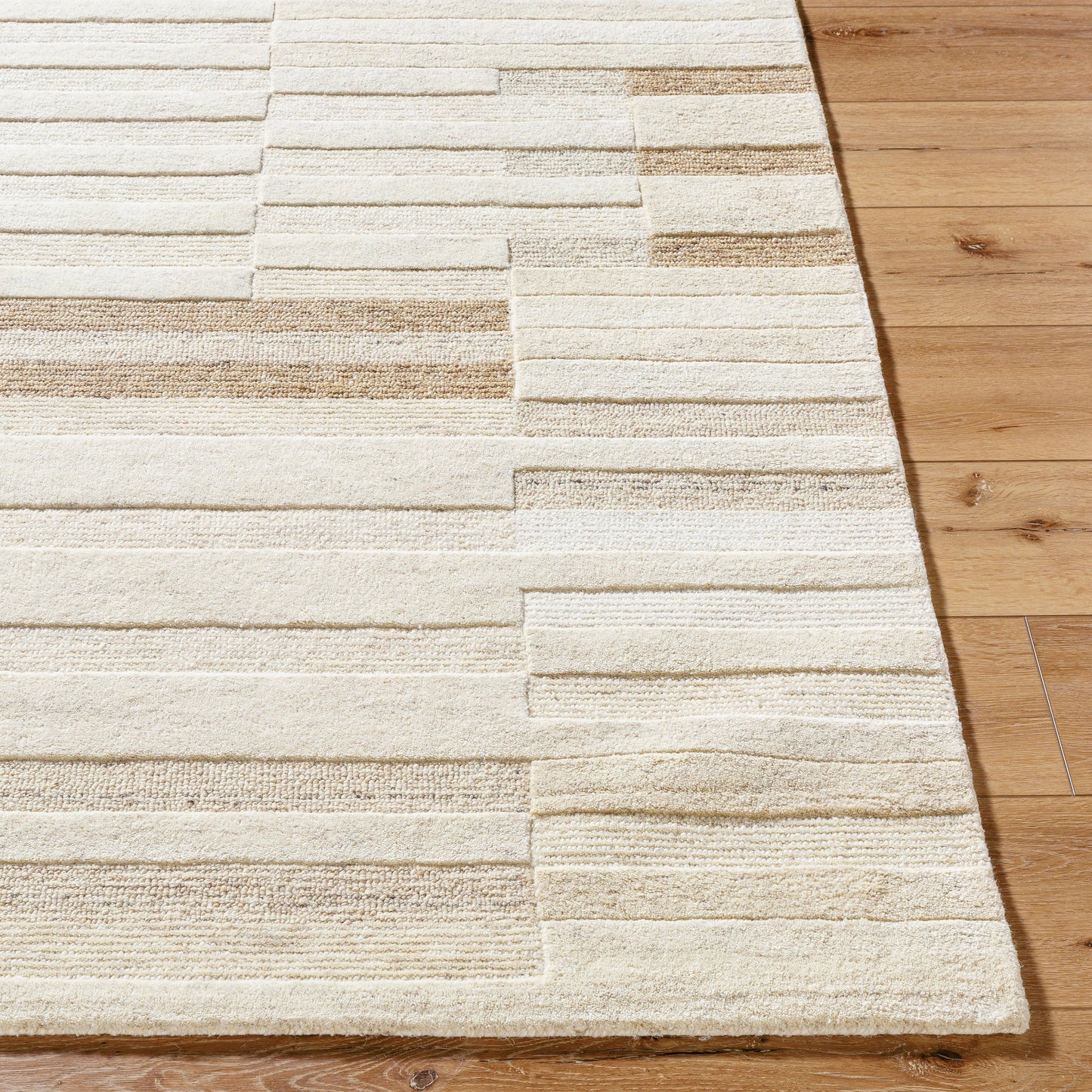 002 SI-2167990,SI-2167991,SI-2167992 | Closeup | Brook Rug - 530267 by Livabliss in ivory, sandstone, taupe, beige, cream. Made from wool in a unique style.