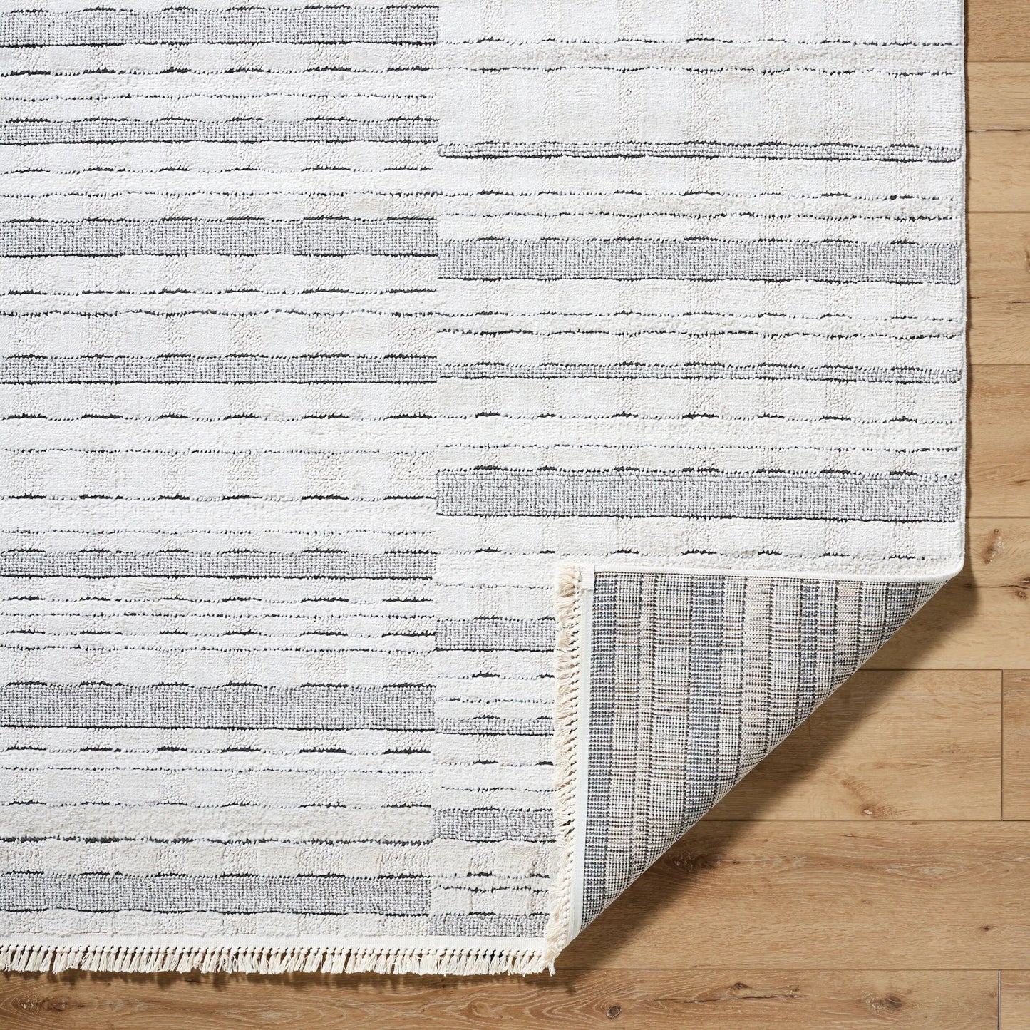 006 SI-2167771,SI-2167772,SI-2167773,SI-2167774 | Closeup | Berlin Rug - 494659 by Livabliss in ivory, black. Made from polypropylene, polyester in a unique style.