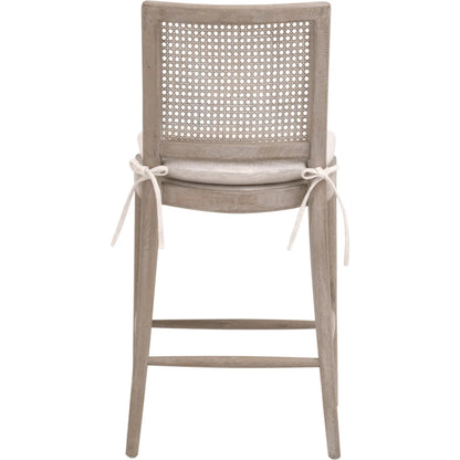 Blume Counter Stool by Essentials For Living in performance textured cream linen, natural gray oak, cane. Made from solid oak wood, cane in a transitional style.