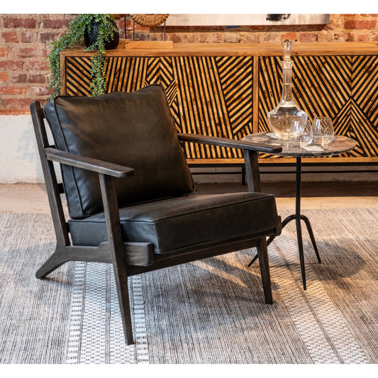 Robert Armchair by World Interiors in black and dark walnut. Made from birch wood top, top grain leather in a unique style.