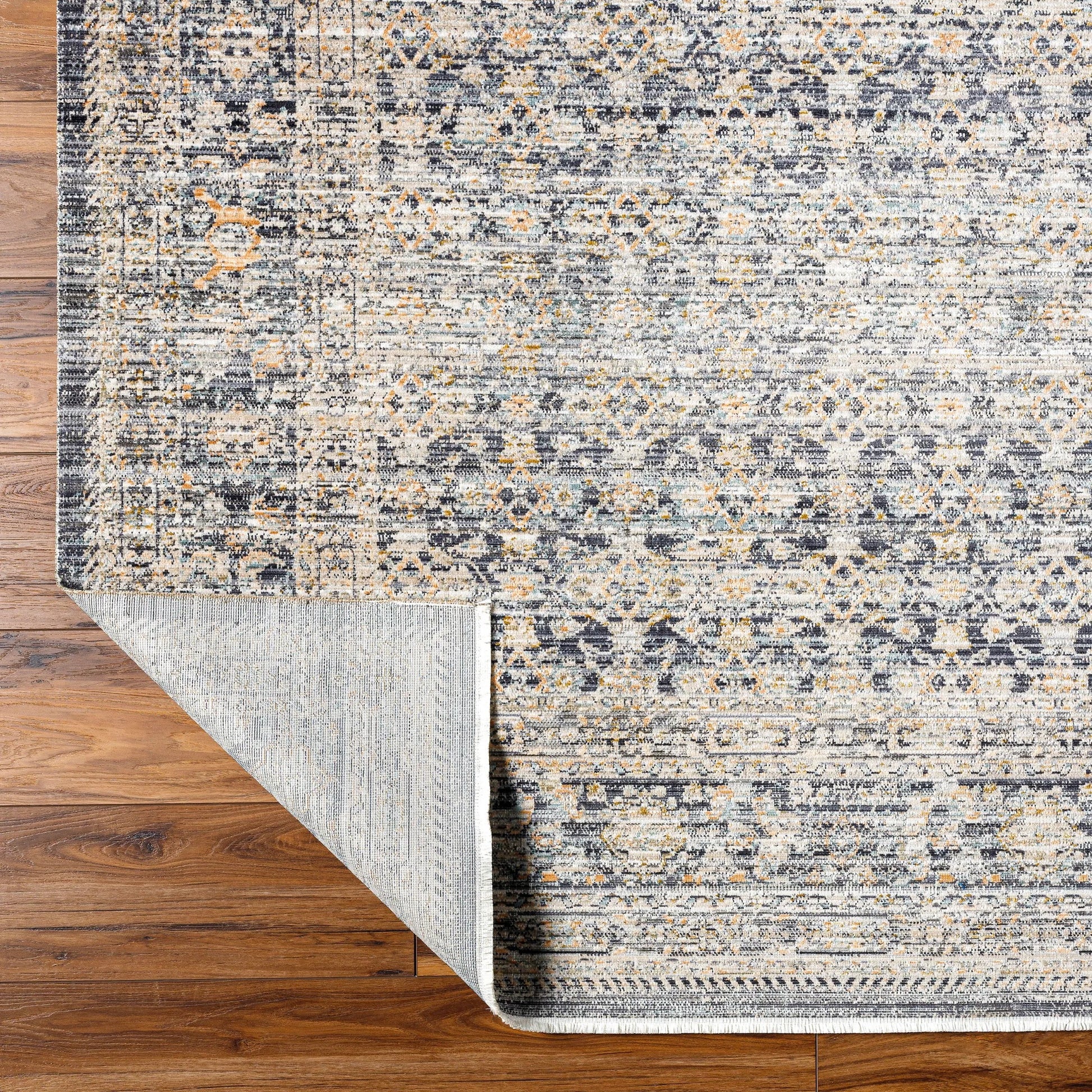 Margaret Rug - 490276 by Becki Owens x Livabliss in taupe, black, charcoal, gray, brown, blue. Made from face: 100% polyester, warp: 100% polypropylene in a unique style.