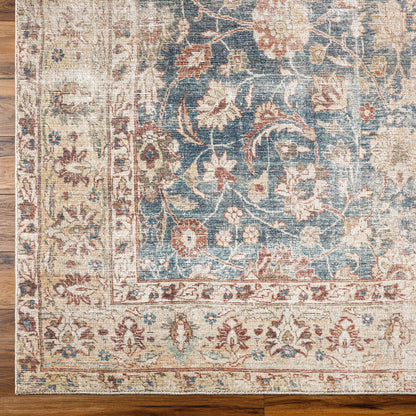 Marlene Rug - 490055 by Becki Owens x Livabliss in ink blue, ivory, tan, rust, brown, dark green. Made from face: 100% polyester, warp: 100% cotton in a