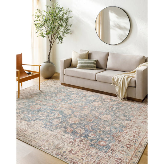 Marlene Rug - 490055 by Becki Owens x Livabliss in ink blue, ivory, tan, rust, brown, dark green. Made from face: 100% polyester, warp: 100% cotton in