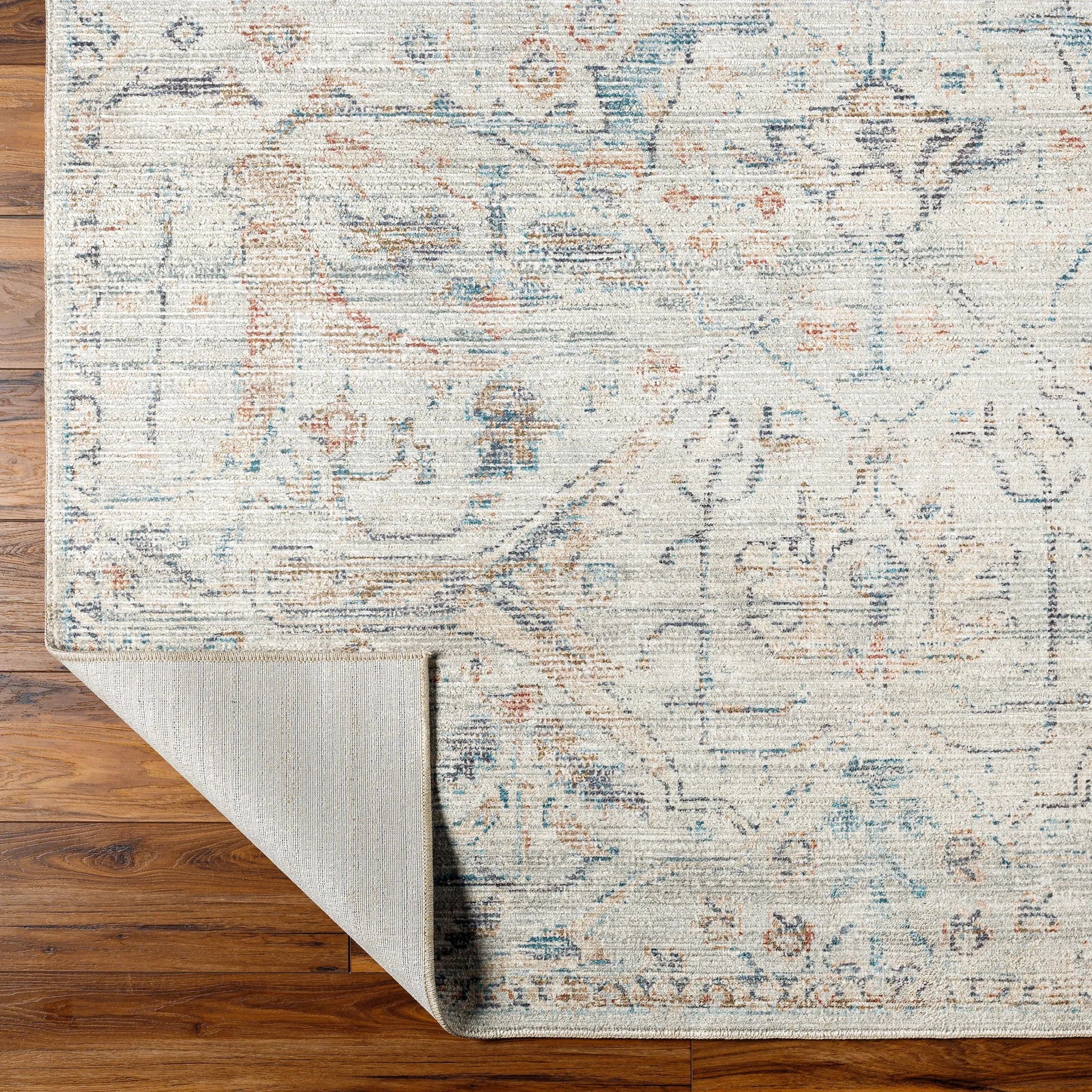 Marlene Rug - 490121 by Becki Owens x Livabliss in cream, pale blue, light blue, olive, rust, black. Made from face: 100% polyester, warp: 100% cotton i