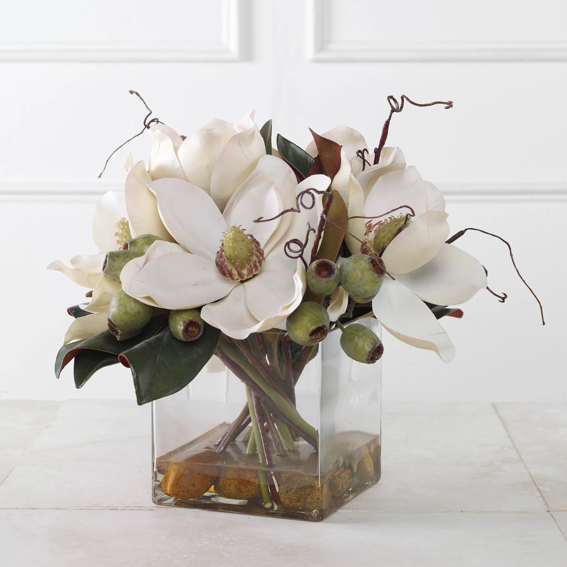 Dobbins Magnolia Bouquet by Uttermost. Made from polyfoam, plastic, stone, iron, glass in a modern style.