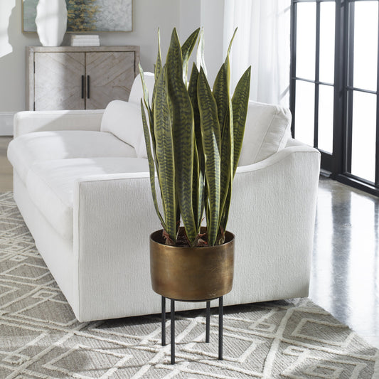 Fasita Planter by Uttermost in antique brass. Made from metal, iron, polyfoam, glue, soil in a modern style.
