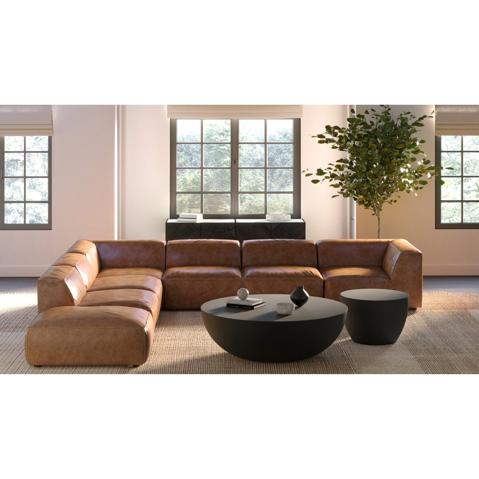 Black Minimal Drum Coffee Table by Moe's Home Collection in black. Made from fiber reinforced natural concrete in a unique style.