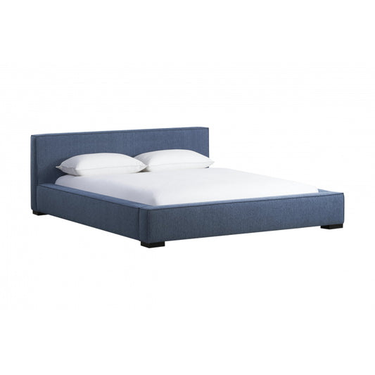 Zest Wide Upholstered Bed by Zest. Made from rubberwood, fabric in a modern style.