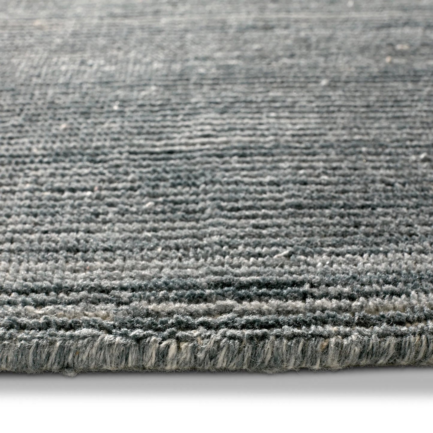 002 SI-2354220,SI-2354221,SI-2385943,SI-2444653 | Closeup | Brevin BRV02 Indoor/Outdoor Rug by Jaipur Living in dark gray, blue. Made from 100% pet yarn in a unique style.