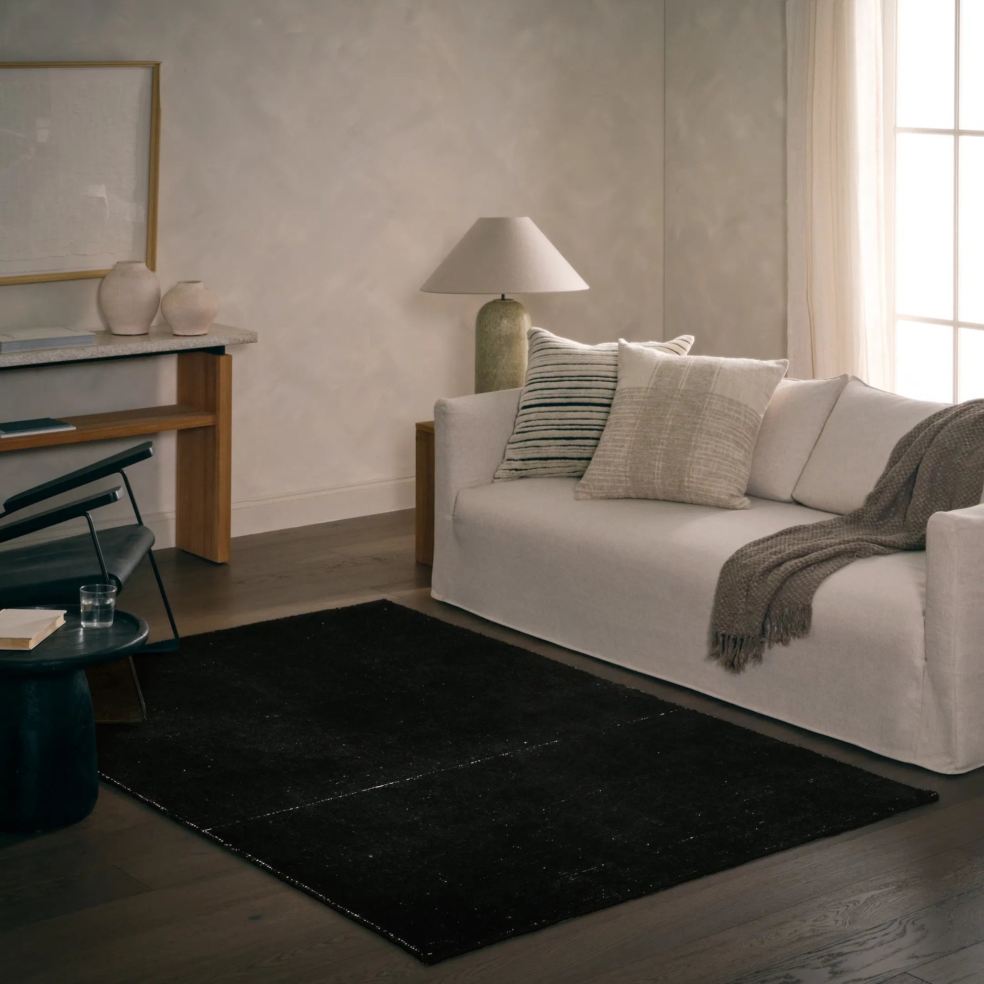 Brevin BRV11 Indoor/Outdoor Rug by Jaipur Living in black. Made from 100% pet yarn in a unique style.