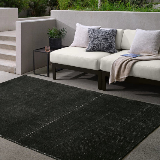 Brevin BRV11 Indoor/Outdoor Rug by Jaipur Living in black. Made from 100% pet yarn in a unique style.