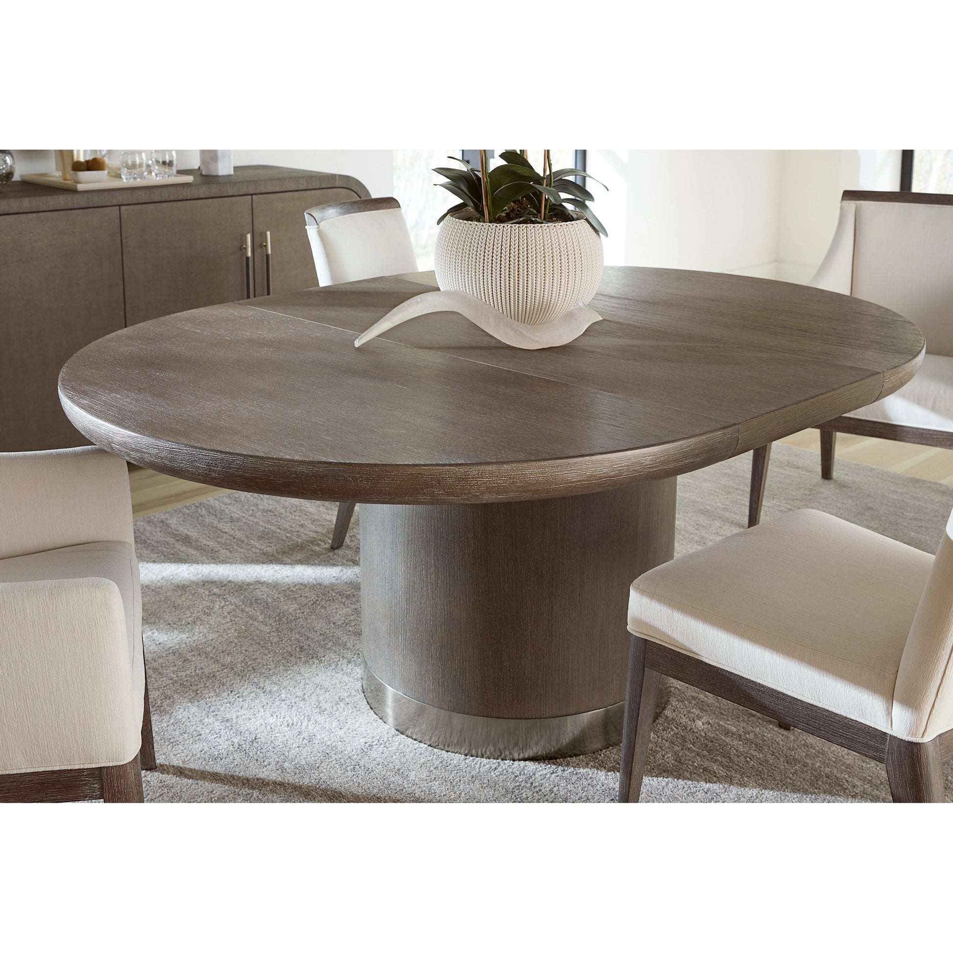 Modern Mood Round Dining Table by Hooker Furniture. Made from oak veneers, metal in a modern style.