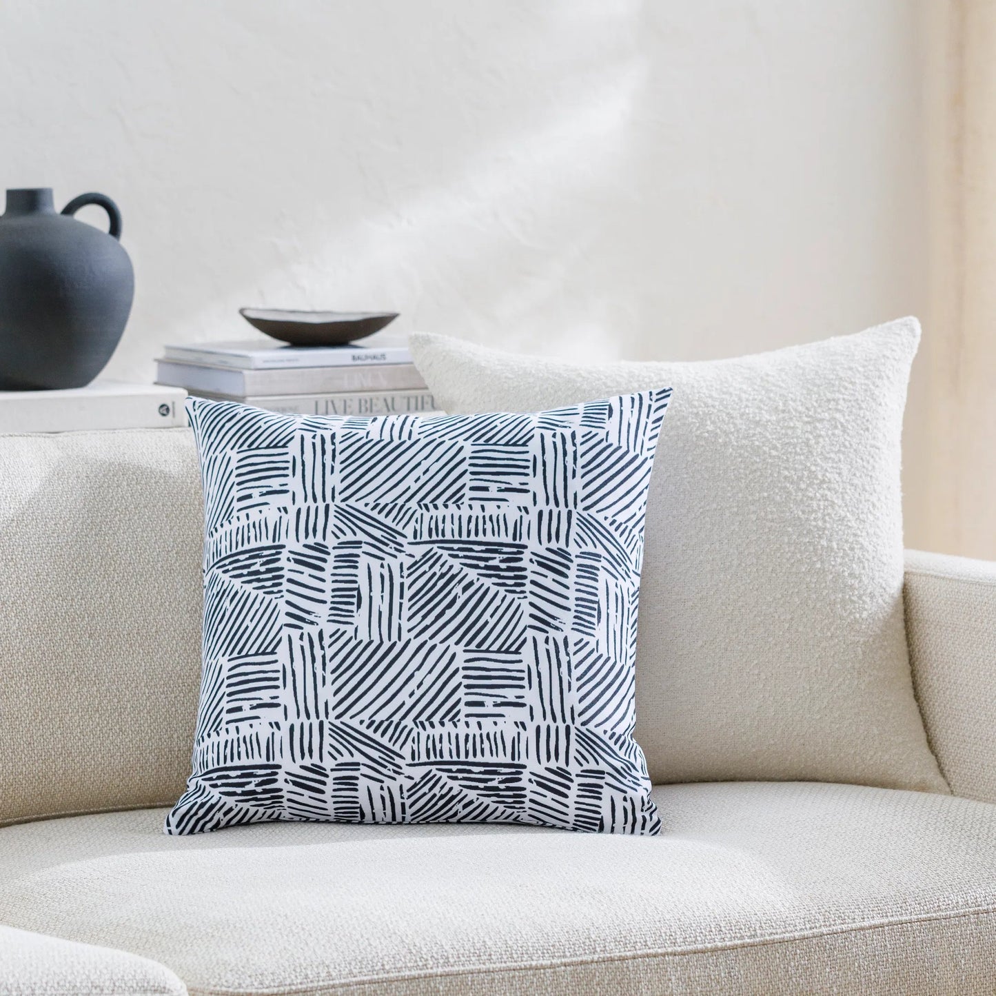 002 SI-2049882,SI-2049883,SI-2049885,SI-2049886,SI-2049888,SI-2049889 | Lifestyle | Baltimore Pillow - 481658 by Livabliss in off-white, ink, light silver, old lavender. Made from front: 100% polyester, back: 100% polyester in a modern style.