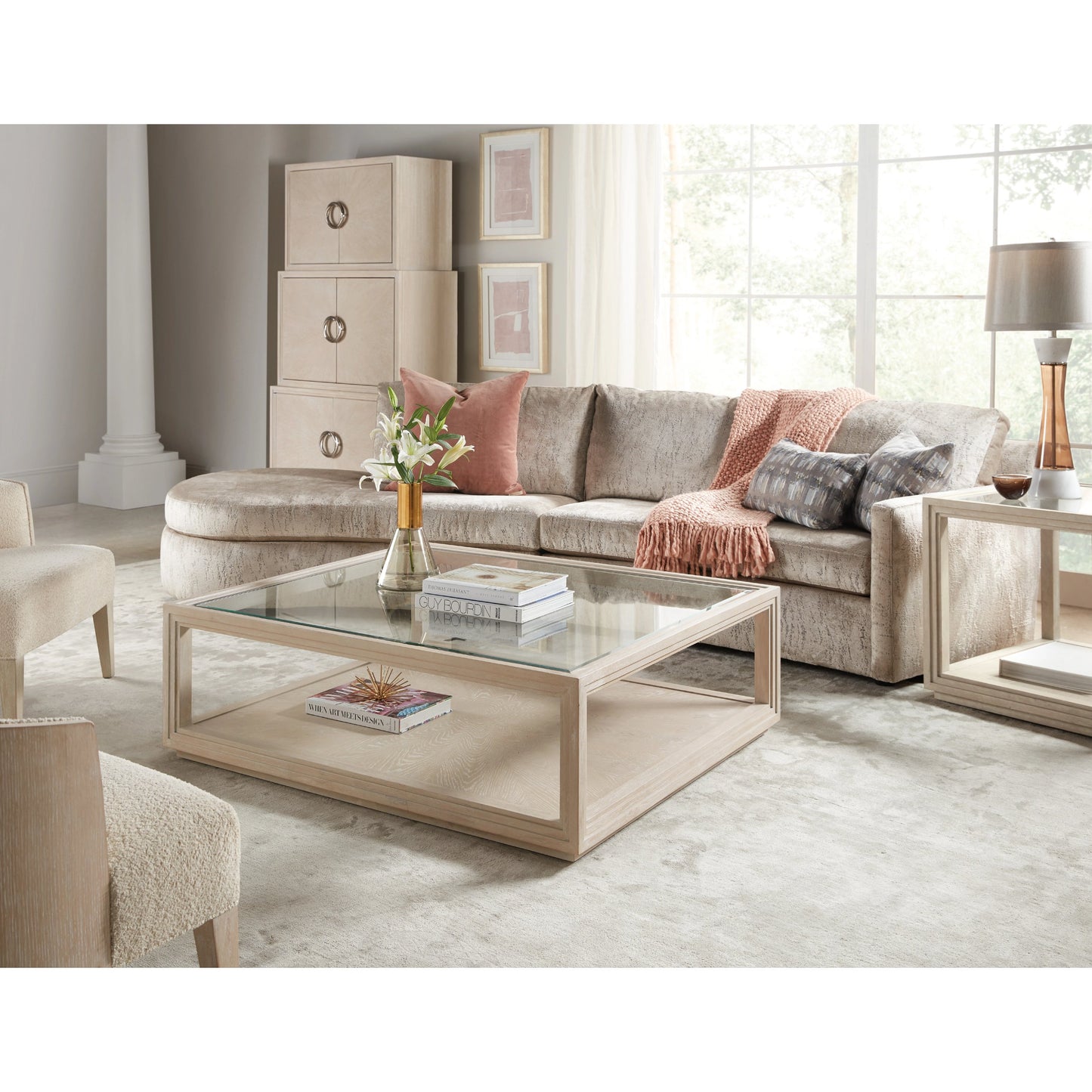 005 SI-2028941 | Lifestyle | Nouveau Chic Rectangle Cocktail Table by Hooker Furniture in sandstone. Made from oak veneers, tempered glass, metal in a modern style.