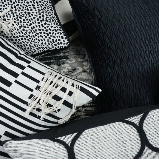 Loose Ends Pillow by DV Kap Home in ivory, black. Made from 86% cotton, 13% polyester, 1% linen in a modern style.