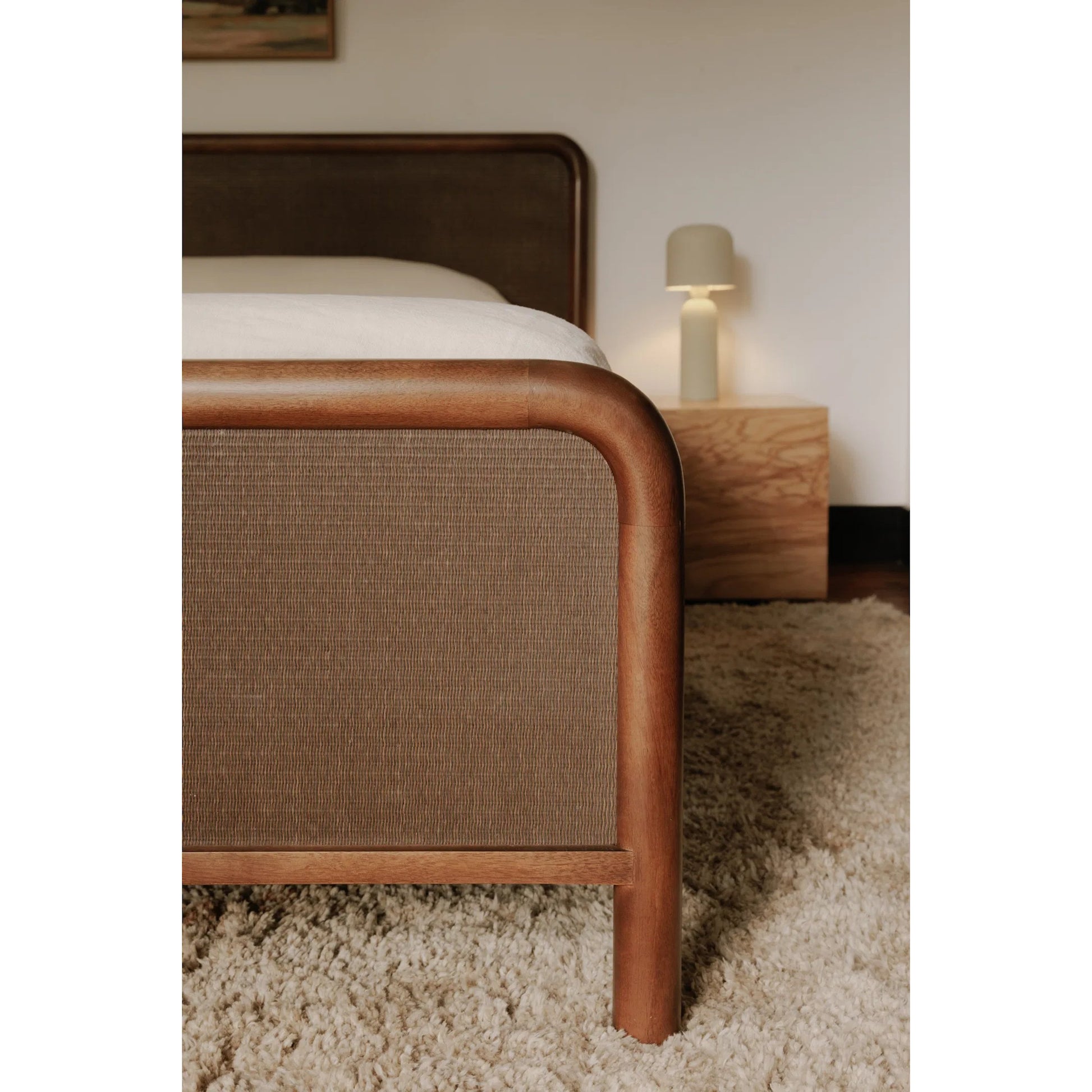 Rye Bed by Moe's Home Collection in warm brown. Made from solid mango wood frame, tatami mat over mdf headboard, footboard, wood slats in a traditional style.