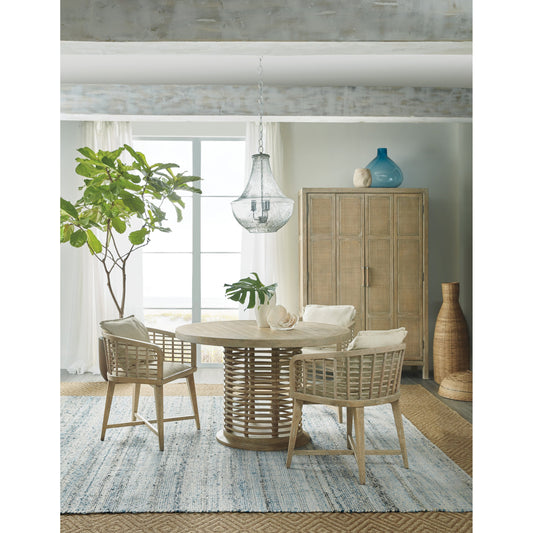 Surfrider Bar Cabinet by Hooker Furniture in driftwood. Made from pecan veneers, rattan, glass, puck light, self-closing undermount drawer guides in a cottage & farmhouse style.