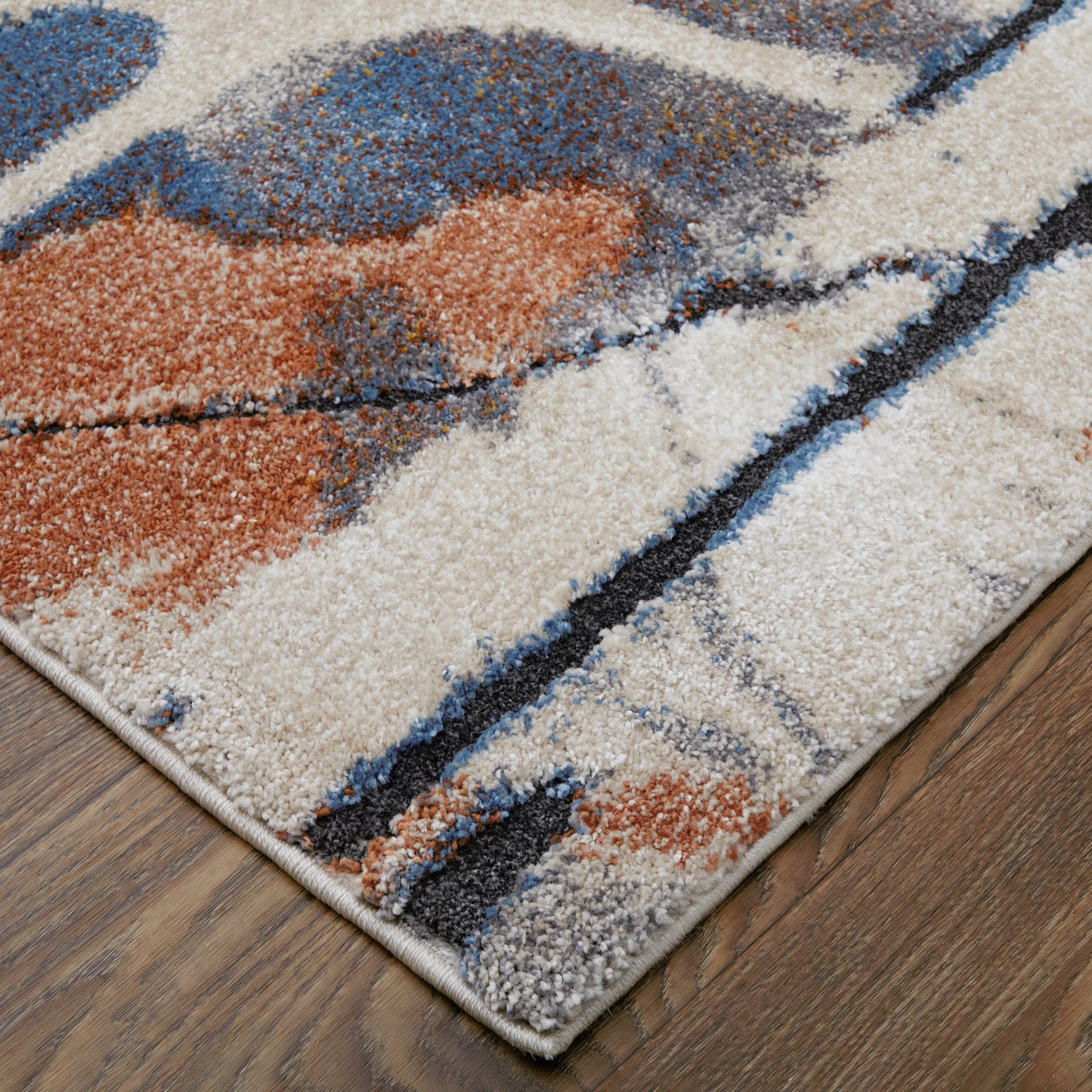 002 SI-2129644,SI-2129645,SI-2129646,SI-2129647,SI-2129648 | Closeup | Gilmore Rug - 39MPF by Feizy in blue, orange, gray. Made from polypropylene in a unique style.