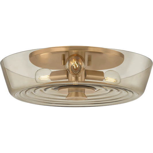 Theodore Flush Mount by Troy in patina brass. Made from clear textured glass, glass in a unique style.