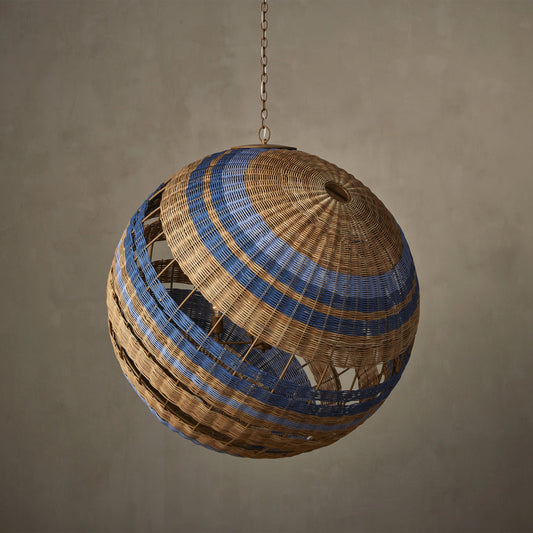 Senjyo Tilted Orb Chandelier by Currey and Company in khaki, natural, cornflower, blue bonnet. Made from rattan, wrought iron in a coastal style.
