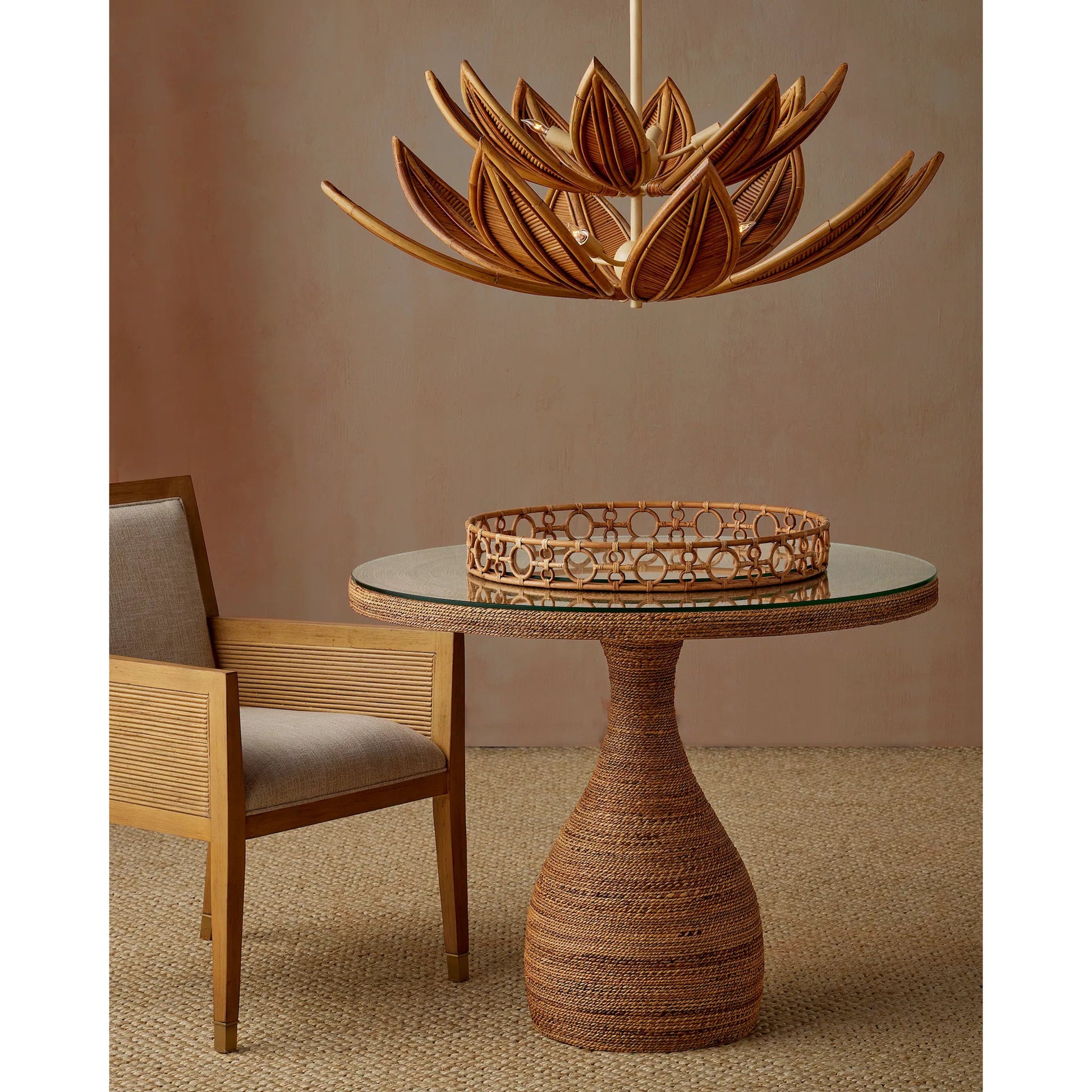 Santos Armchair by Currey and Company. Made from mahogany, rattan, brass in a modern style.