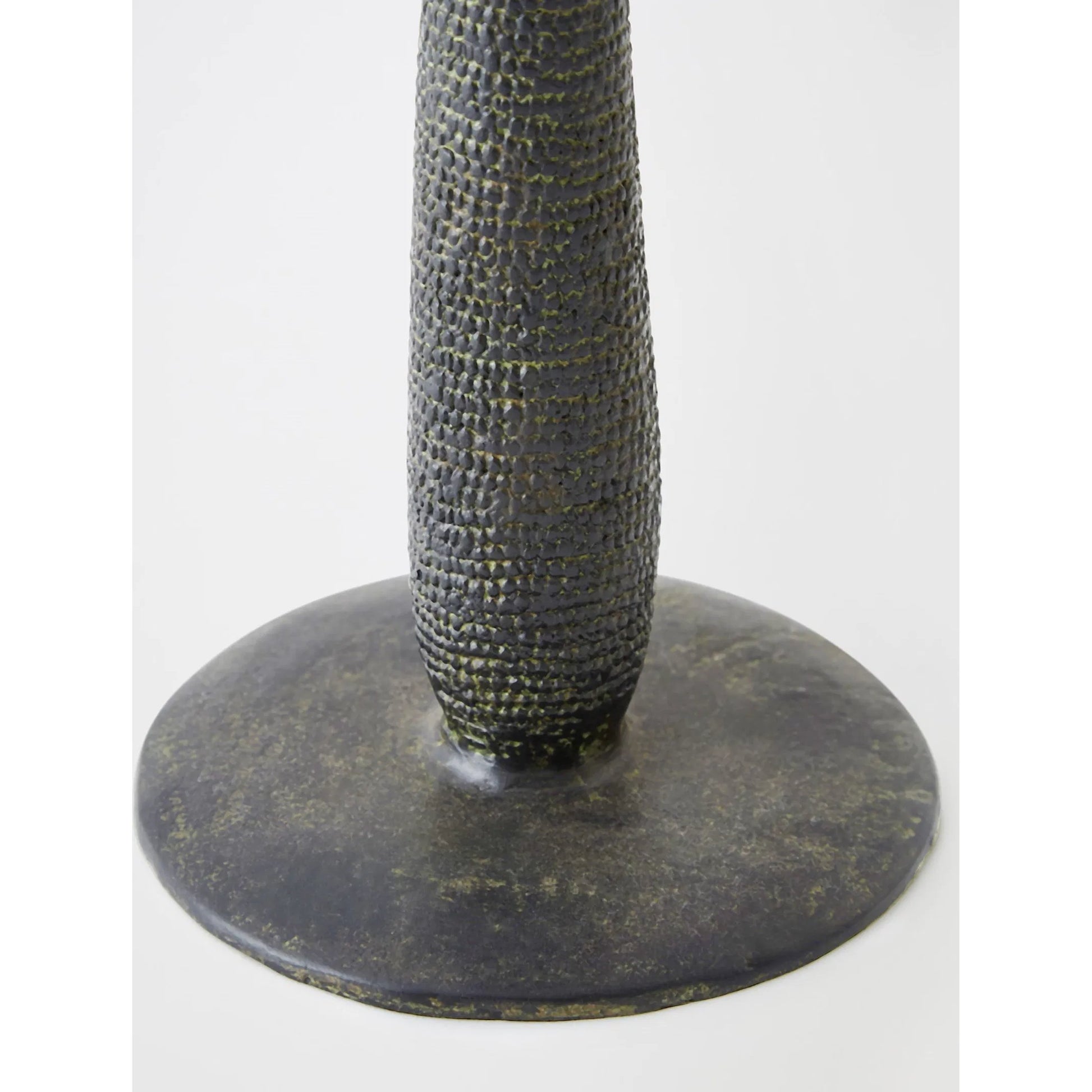 Totem Candlestick by Global Views in verdigris. Made from cast iron in a rustic style.