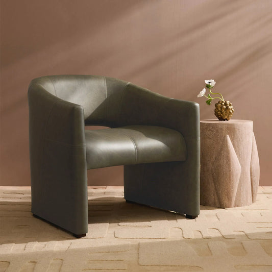 Tusk Side Table by Global Views in natural. Made from travertine in a transitional style.