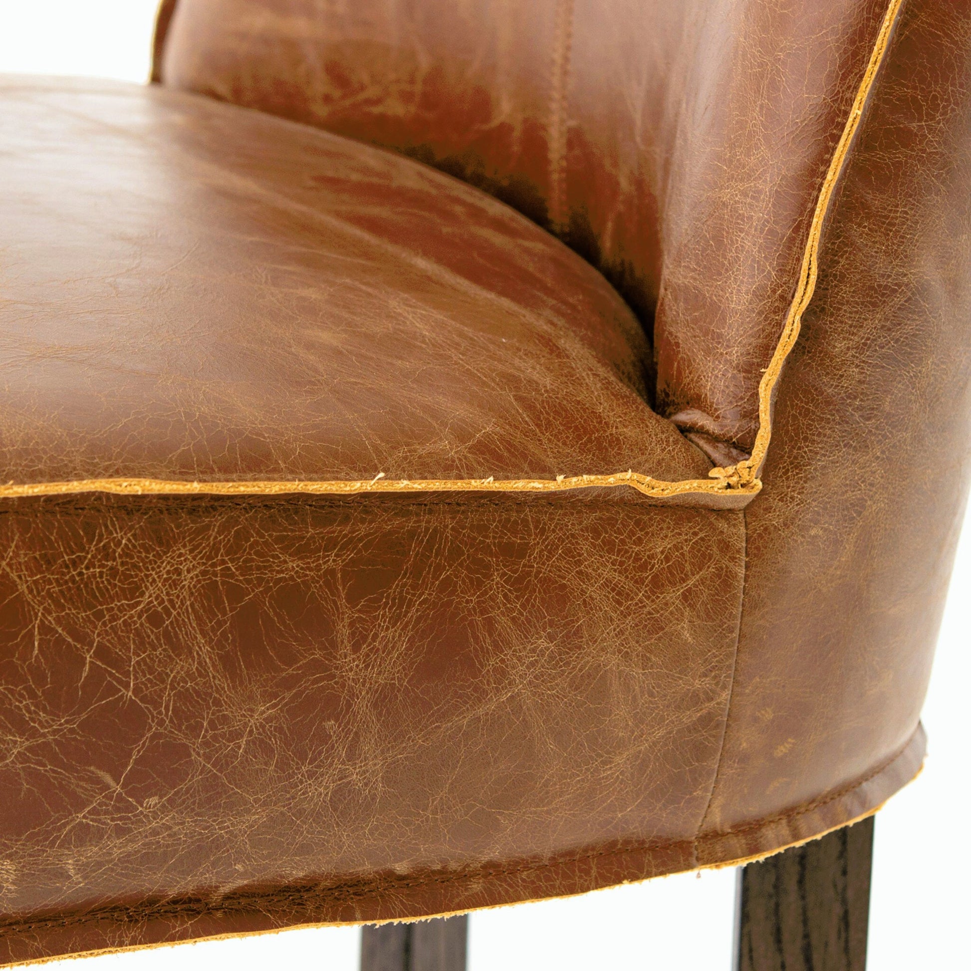 Aria Counter Stool by Four Hands in sienna chestnut. Made from top grain leather, solid nettlewood, 100% polyester in a modern style.