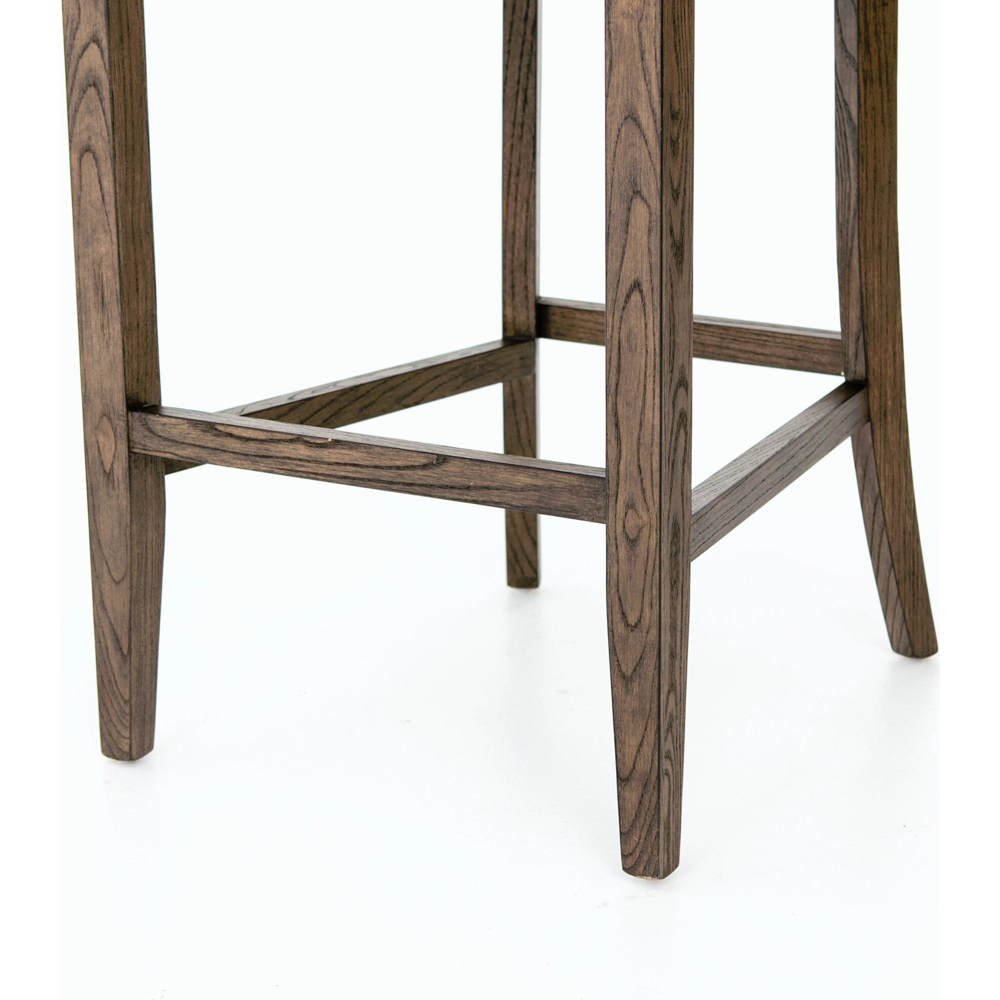 Aria Counter Stool by Four Hands in sienna chestnut. Made from top grain leather, solid nettlewood, 100% polyester in a modern style.