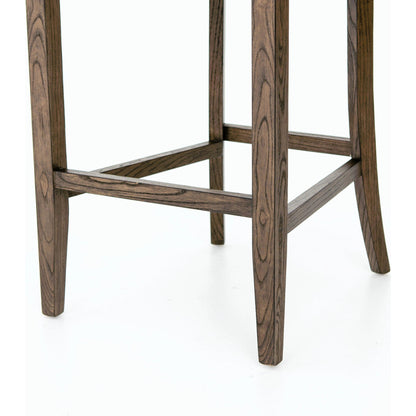 Aria Counter Stool by Four Hands in sienna chestnut. Made from top grain leather, solid nettlewood, 100% polyester in a modern style.