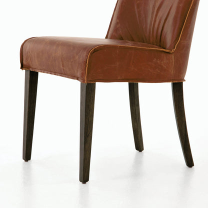 Aria Dining Chair by Four Hands in sienna chestnut, warm nettlewood and sienna chestnut. Made from top grain leather, solid nettlewood, 100% polyester in a modern style.