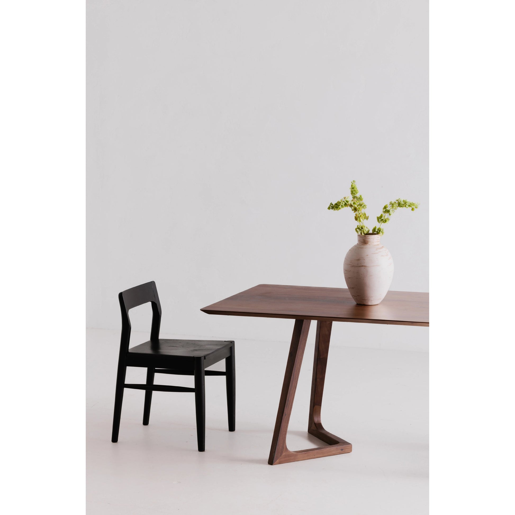 Godenza Dining Table by Moe's Home Collection in brown. Made from solid american walnut in a modern style.