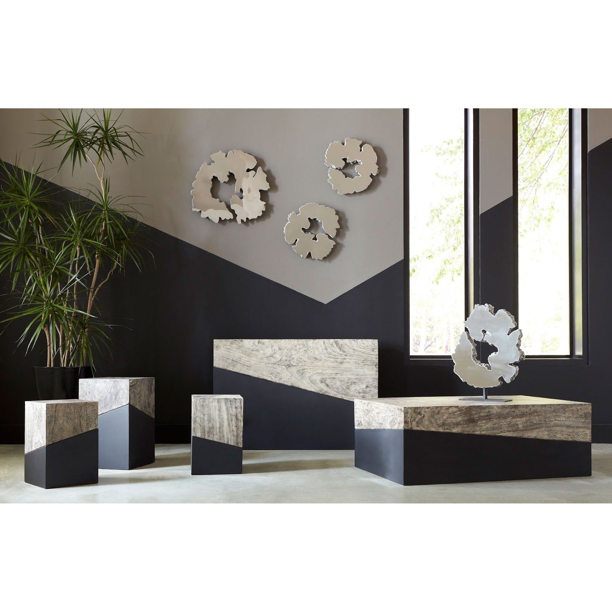 Geometry Side Table by Phillips Collection in gray stone. Made from wood in a rustic style.