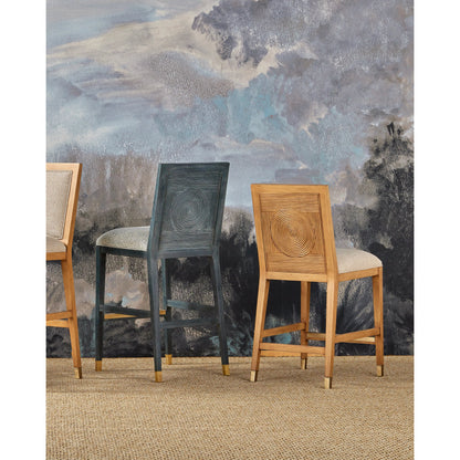 Santos Counter Stool by Currey and Company. Made from mahogany, rattan, brass in a modern style.