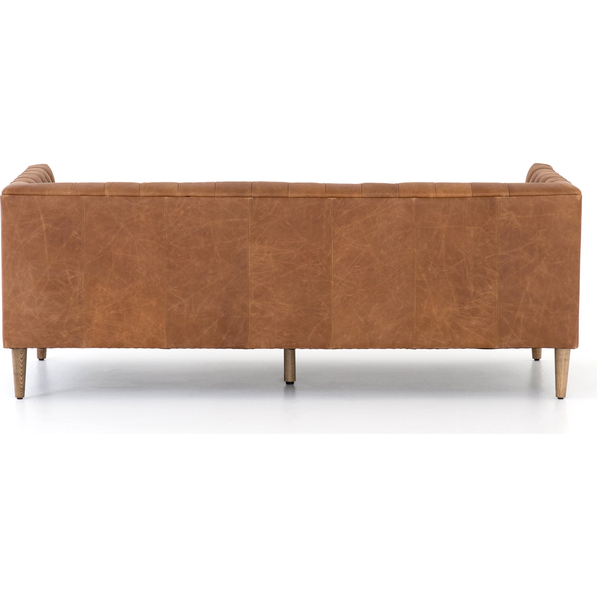 Williams Leather Sofa by Four Hands. Made from top grain leather, solid ash, 100% polyester in a rustic style.