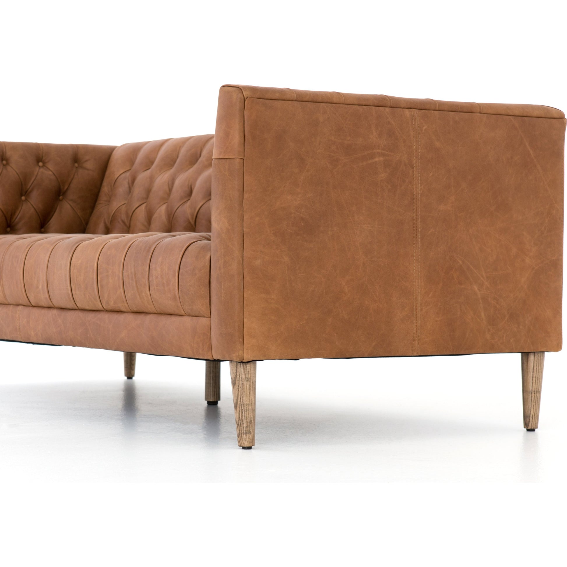 Williams Leather Sofa by Four Hands. Made from top grain leather, solid ash, 100% polyester in a rustic style.