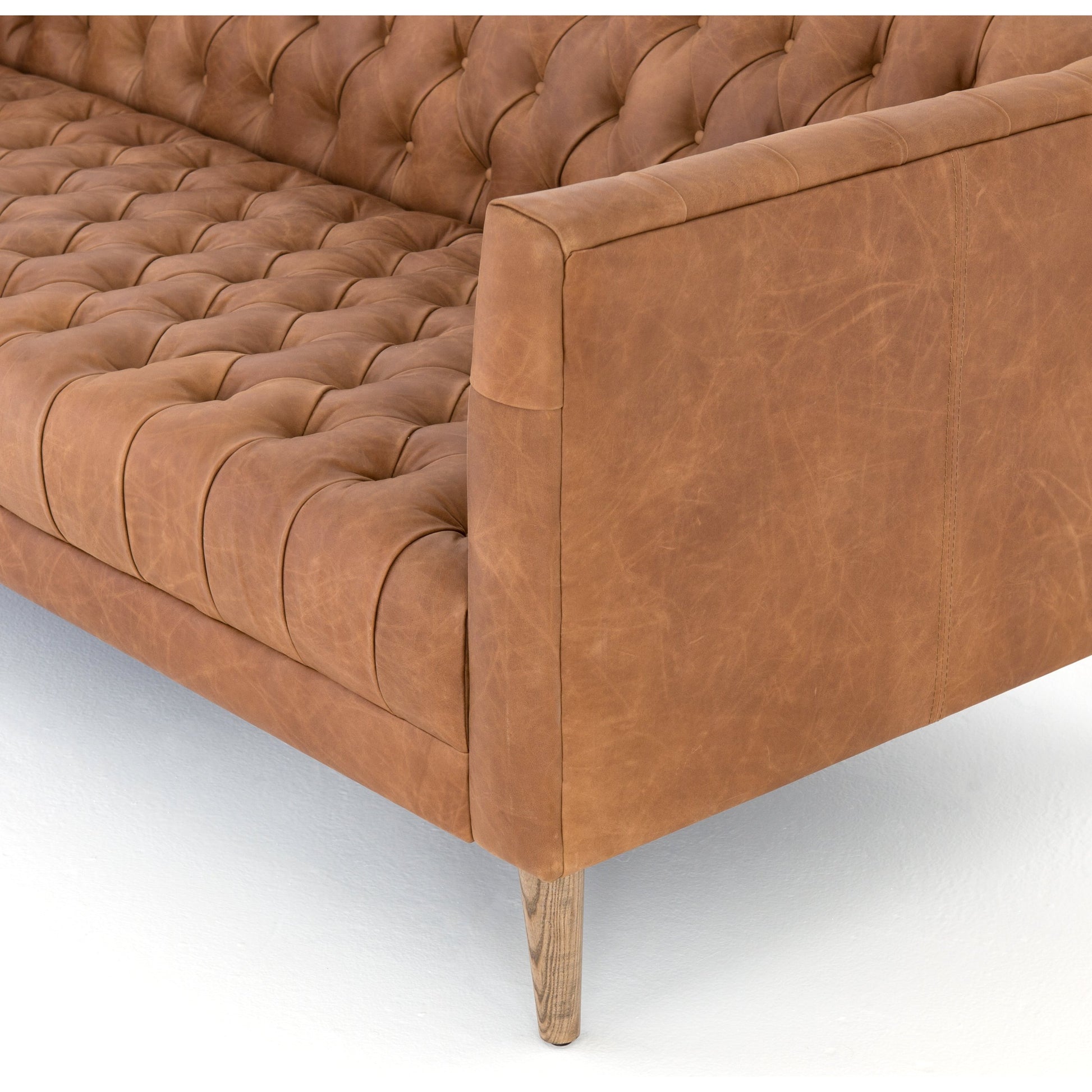 Williams Leather Sofa by Four Hands. Made from top grain leather, solid ash, 100% polyester in a rustic style.