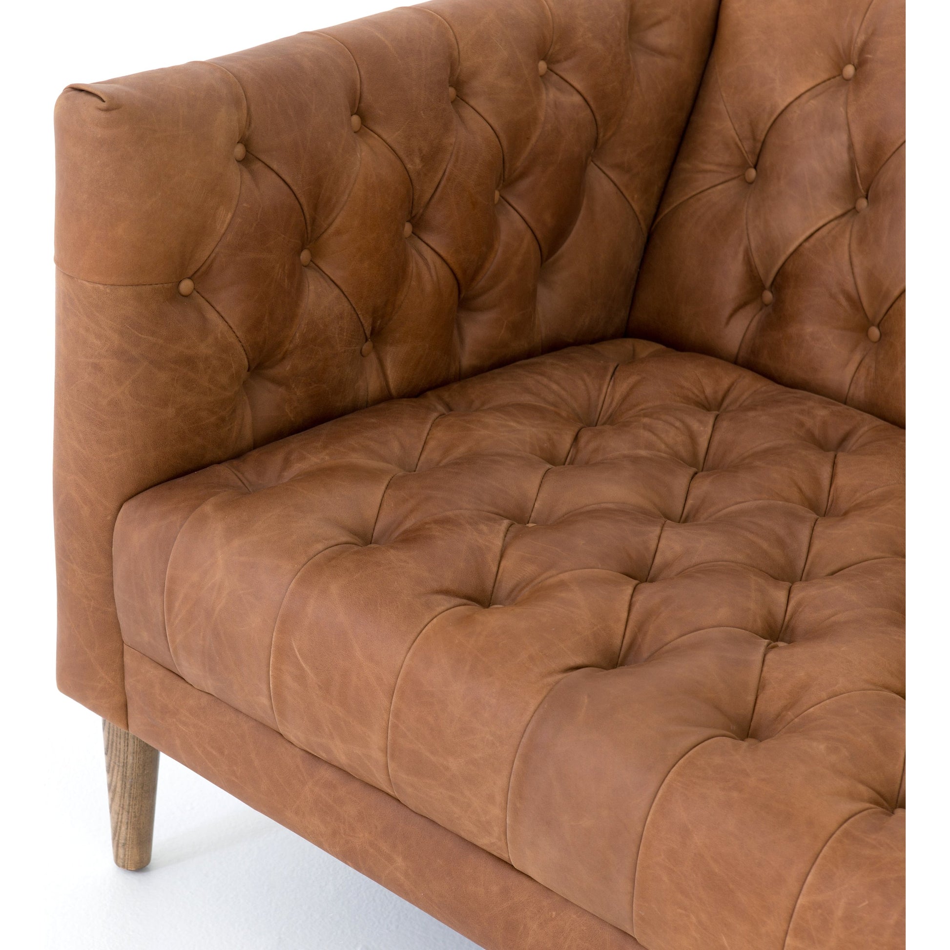Williams Leather Sofa by Four Hands. Made from top grain leather, solid ash, 100% polyester in a rustic style.
