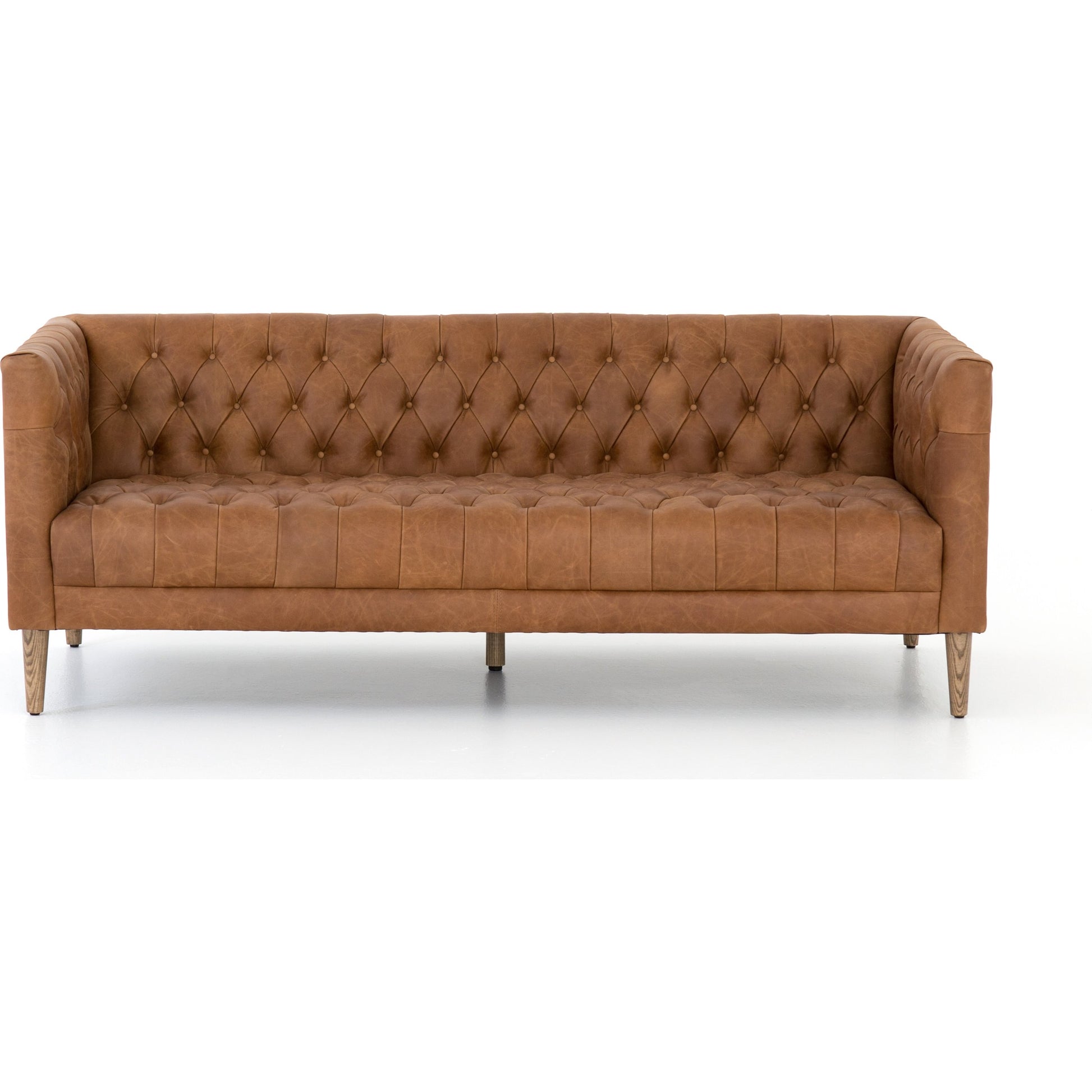 Williams Leather Sofa by Four Hands. Made from top grain leather, solid ash, 100% polyester in a rustic style.