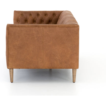 Williams Leather Sofa by Four Hands. Made from top grain leather, solid ash, 100% polyester in a rustic style.