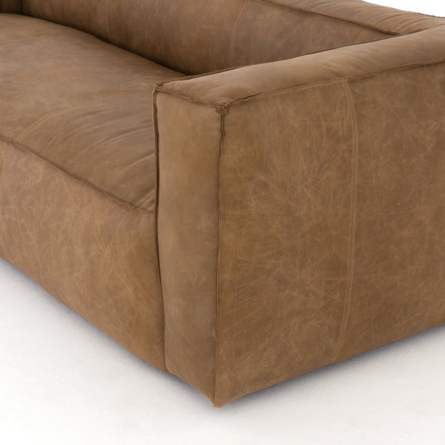 024 SR-369159 | Closeup | Nolita Reverse Stitch Sofa by Four Hands. Made from top grain leather, solid ash, 100% polyester in a modern style.