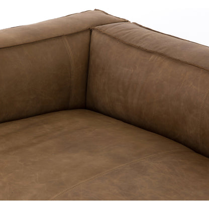 Nolita Reverse Stitch Sofa by Four Hands in rider black. Made from top grain leather, solid ash, 100% polyester in a modern style.