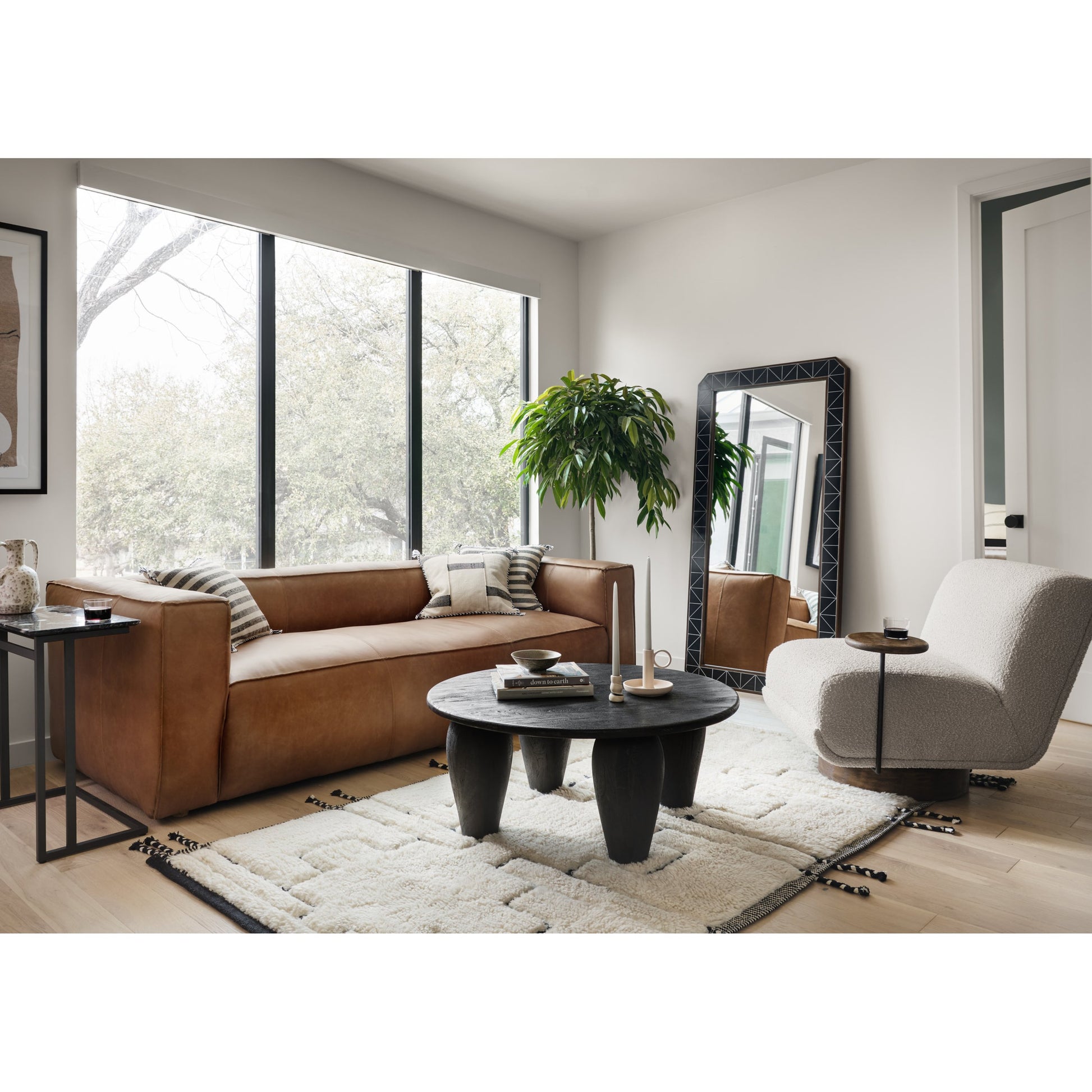 Nolita Reverse Stitch Sofa by Four Hands in rider black. Made from top grain leather, solid ash, 100% polyester in a modern style.