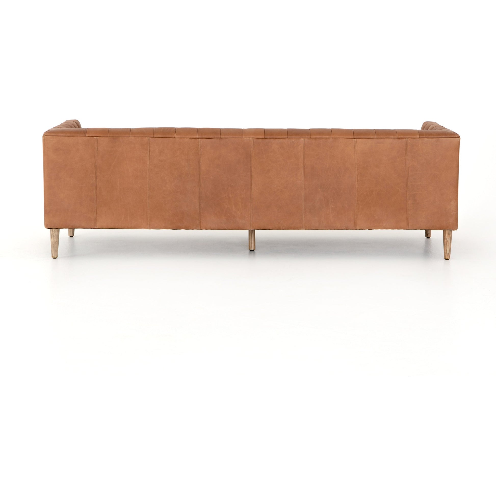 Williams Leather Sofa by Four Hands. Made from top grain leather, solid ash, 100% polyester in a rustic style.