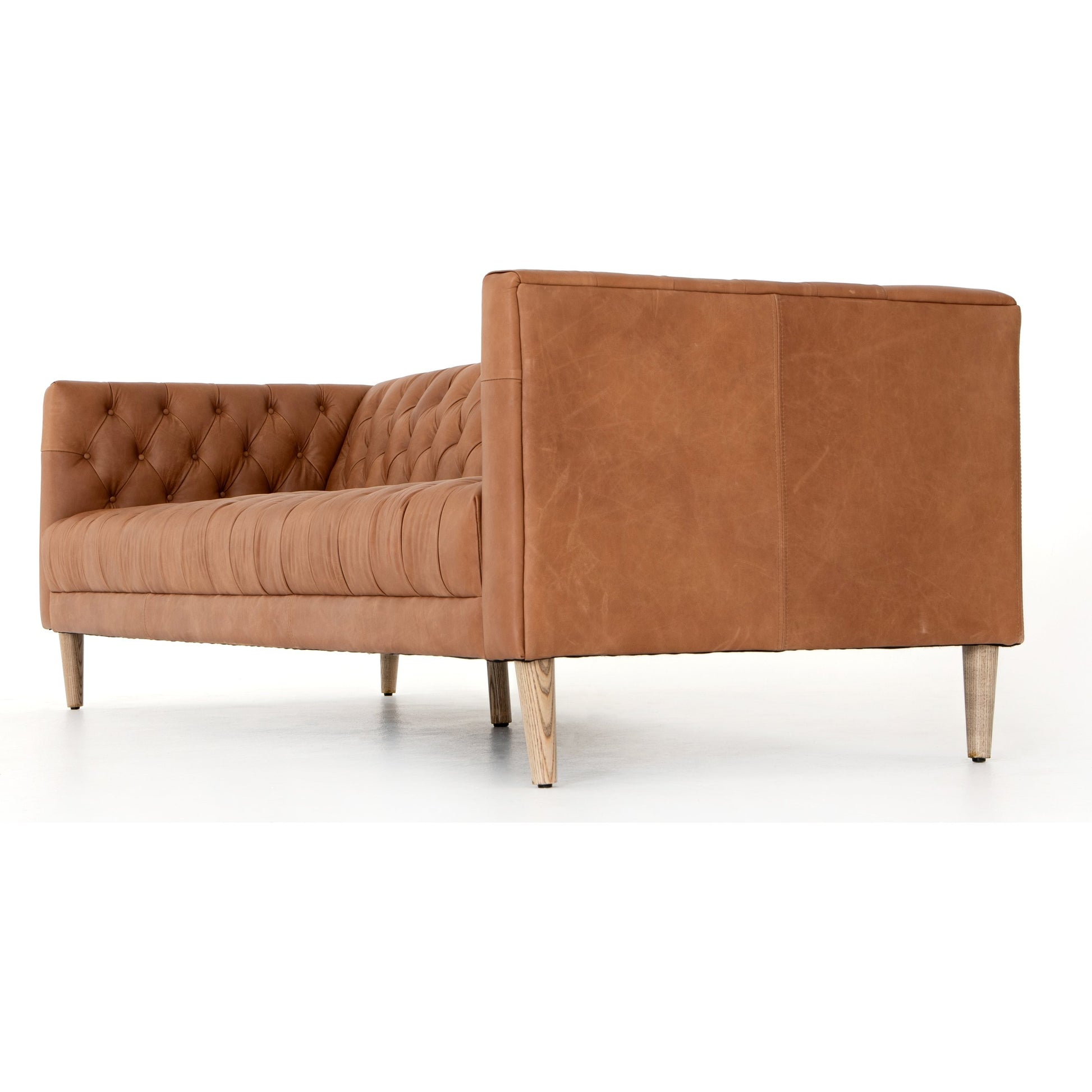 Williams Leather Sofa by Four Hands. Made from top grain leather, solid ash, 100% polyester in a rustic style.