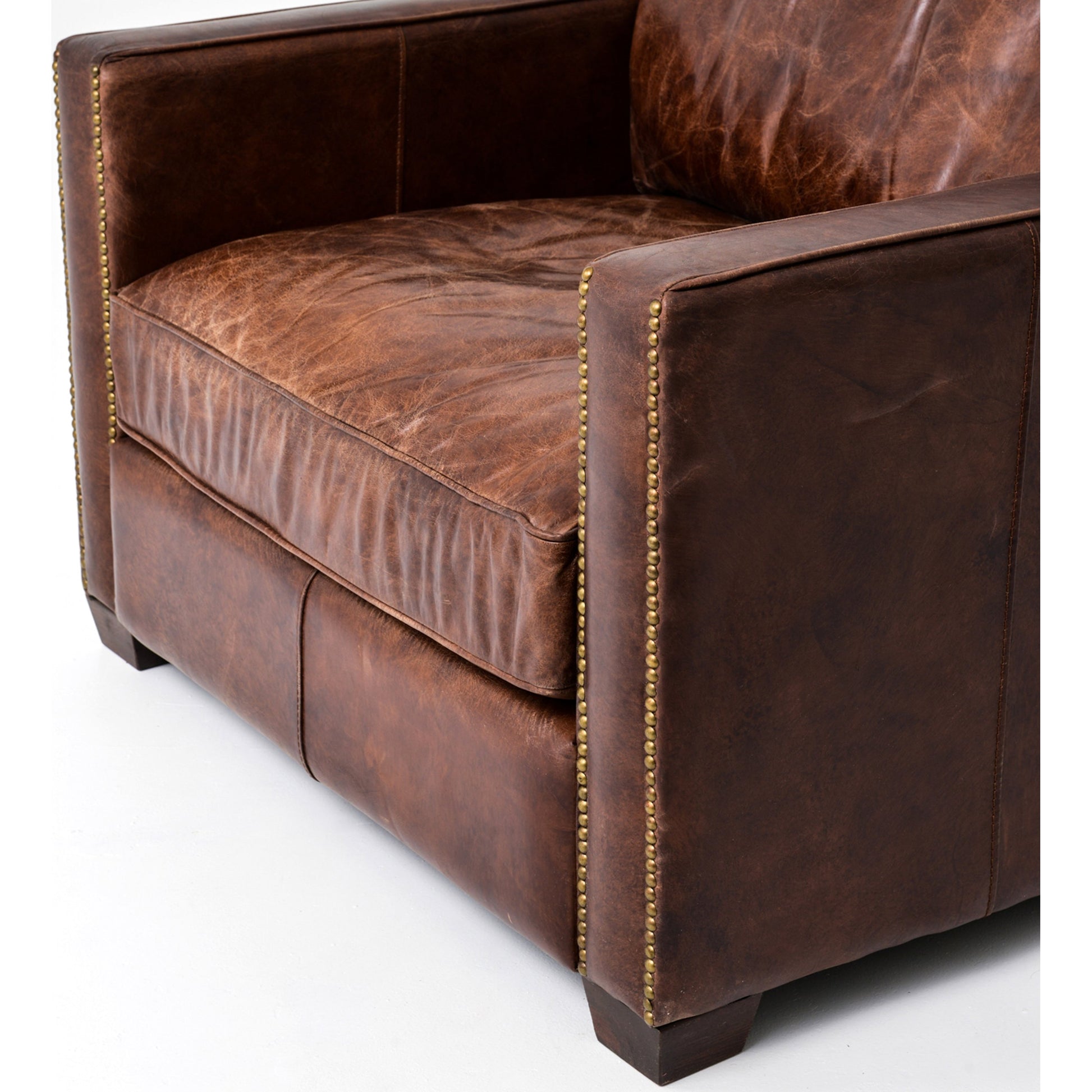 Larkin Club Chair by Four Hands in cigar and antique oak, antique brass nailhead. Made from top grain leather, solid ash, iron in a modern style.