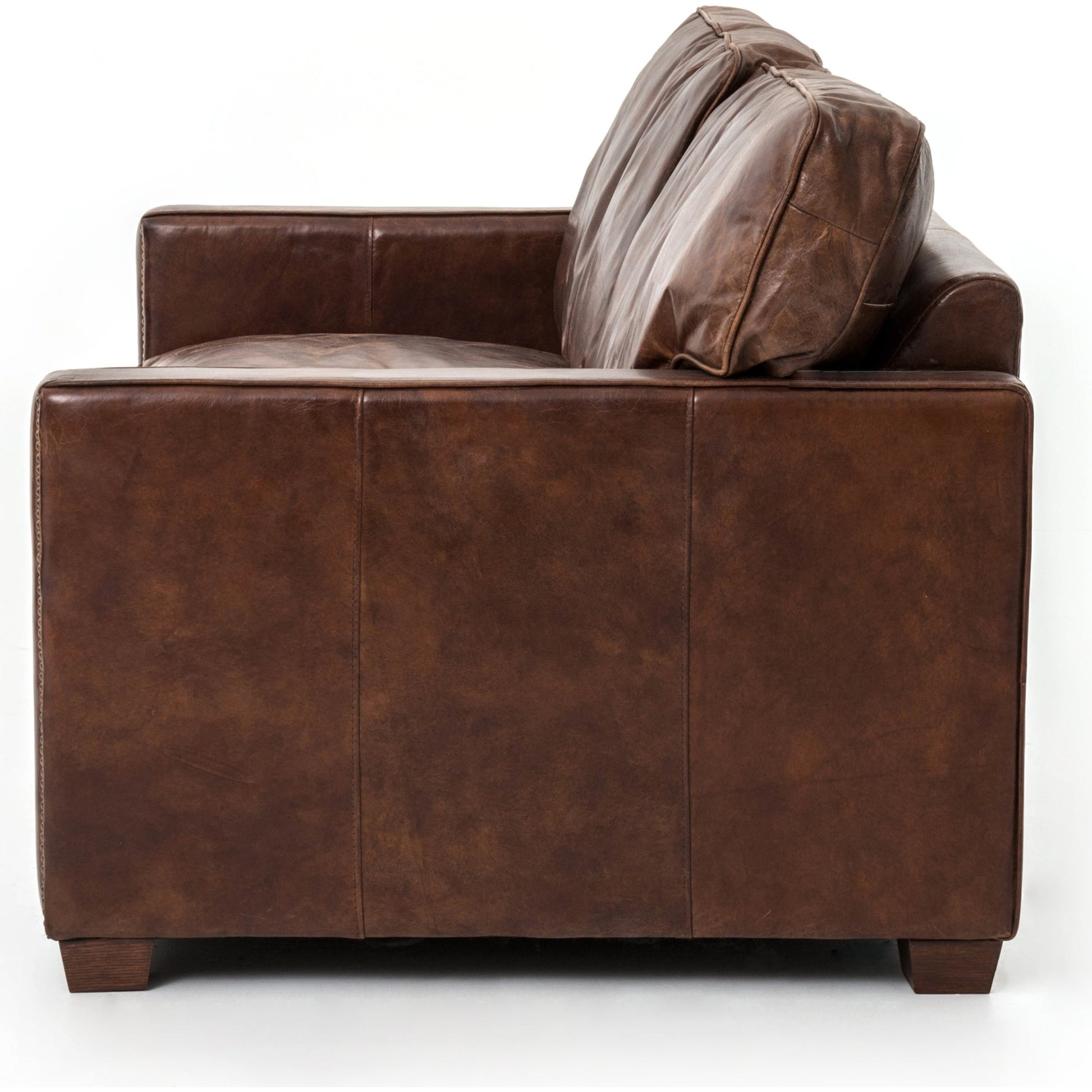 Larkin Sofa by Four Hands in cigar, antique oak, antique brass nailhead. Made from top grain leather, solid ash, iron in a modern style.