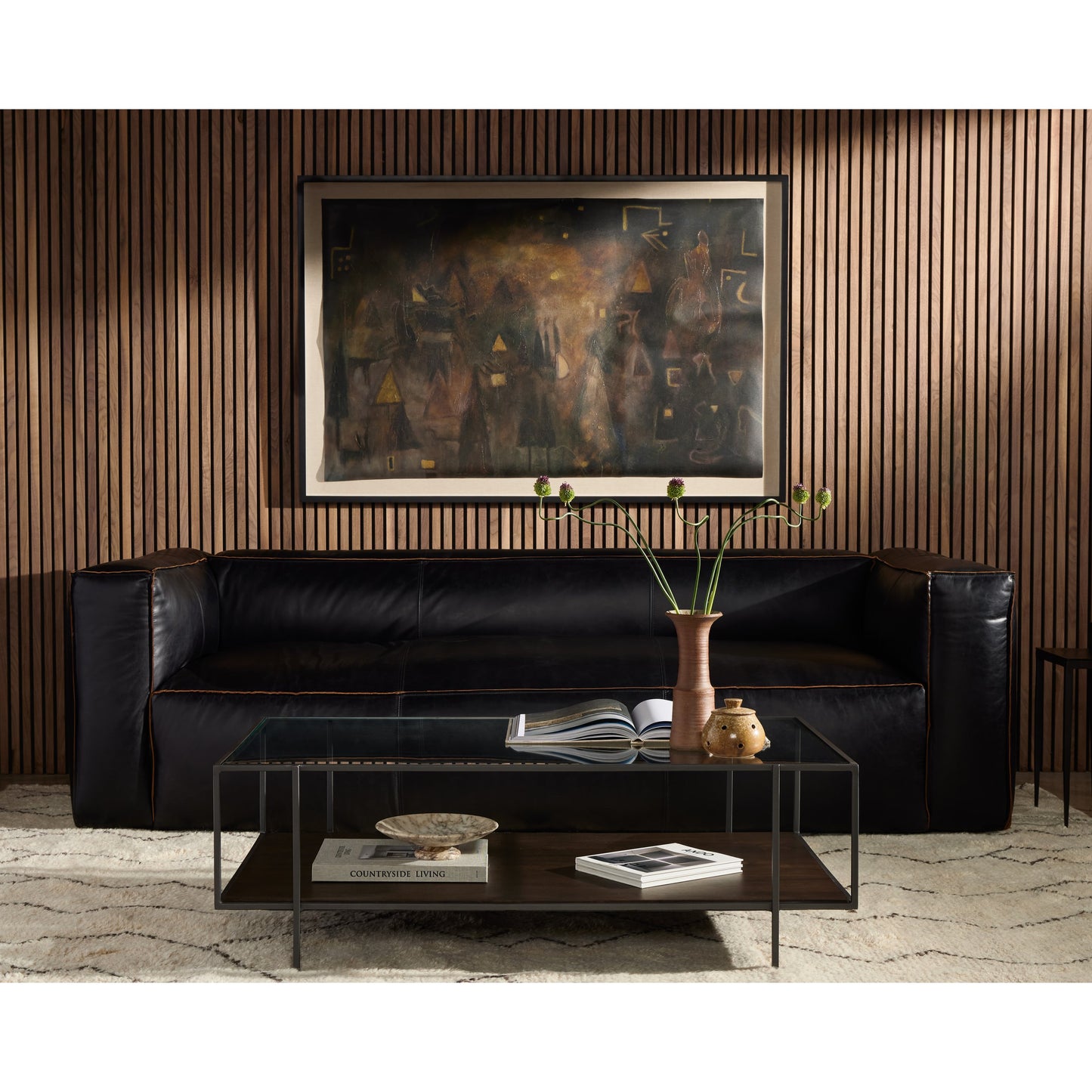 017 S-279451 | Lifestyle | Nolita Reverse Stitch Sofa by Four Hands in rider black. Made from top grain leather, solid ash, 100% polyester in a modern style.