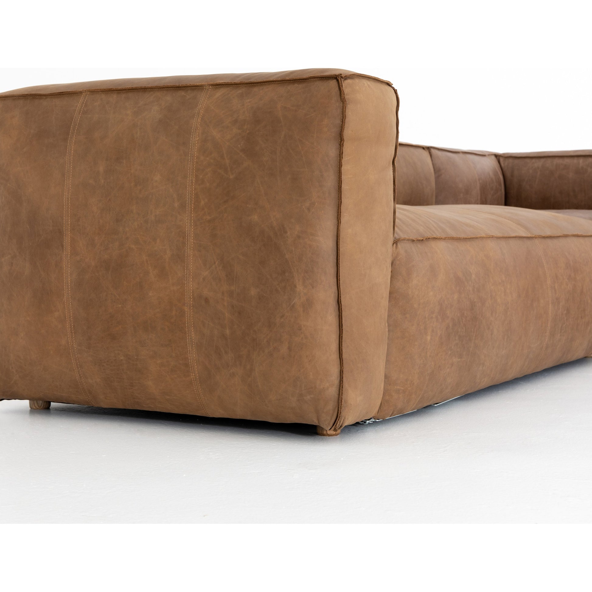 Nolita Sectional Sofa by Four Hands in natural washed. Made from top grain leather, solid ash, 100% polyester in a modern style.